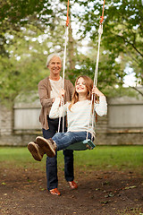 Image showing happy family in front of house outdoors