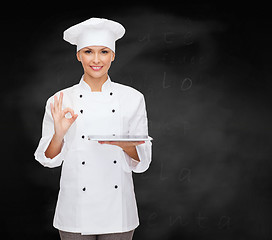 Image showing smiling female chef with tablet pc computer