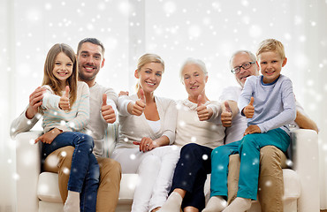 Image showing happy family sitting on couch at home