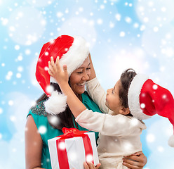 Image showing happy mother and child girl with gift box