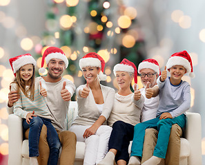 Image showing happy family sitting on couch