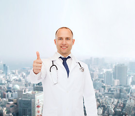 Image showing smiling doctor with stethoscope showing thumbs up