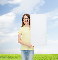 Image showing little girl wearing eyeglasses with blank board