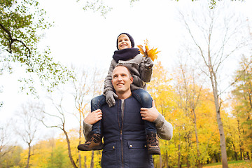 Image showing happy family having fun in autumn park