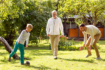 Image showing happy family playing football outdoors