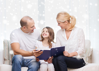 Image showing happy family with book at home