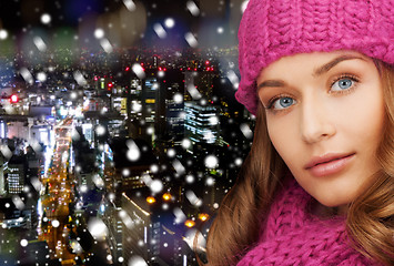 Image showing close up of smiling young woman in winter clothes