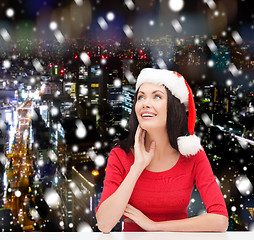 Image showing smiling woman in santa helper hat