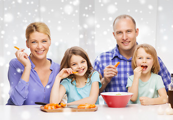 Image showing happy family with two kids making dinner at home