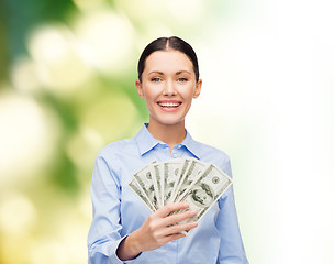 Image showing businesswoman with dollar cash money