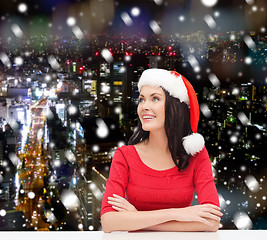 Image showing smiling woman in santa helper hat