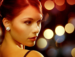 Image showing woman in evening dress wearing diamond earrings