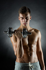 Image showing young man with dumbbell