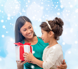 Image showing happy mother and child girl with gift box