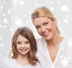 Image showing smiling mother and little girl