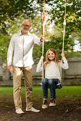 Image showing happy family in front of house outdoors