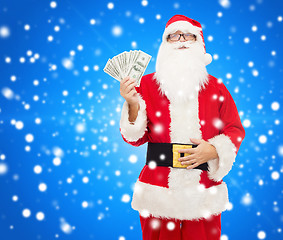 Image showing man in costume of santa claus with dollar money