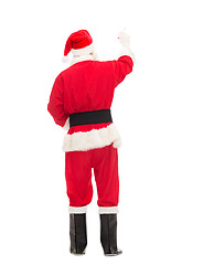 Image showing man in costume of santa claus writing something