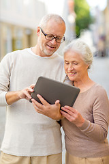 Image showing senior couple photographing on city street