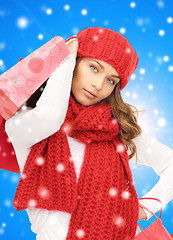 Image showing smiling young woman with shopping bags