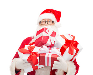 Image showing man in costume of santa claus with gift boxes