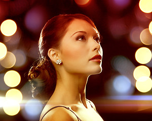 Image showing woman in evening dress wearing diamond earrings