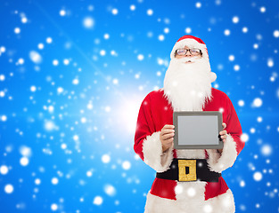 Image showing man in costume of santa claus with tablet pc