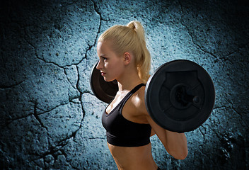 Image showing sporty woman exercising with barbell