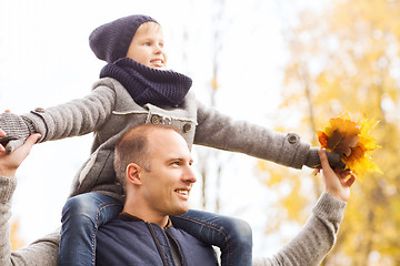 Image showing happy family having fun in autumn park