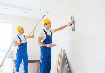 Image showing group of builders with tools indoors