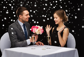 Image showing smiling couple at restaurant