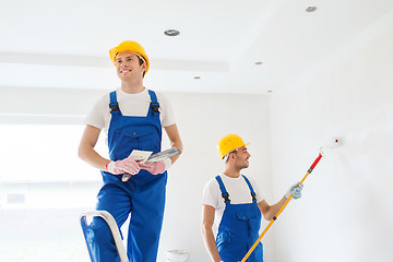 Image showing group of builders with tools indoors