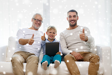 Image showing smiling family with tablet pc at home