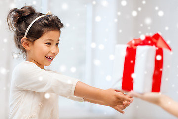 Image showing smiling little girl with gift box