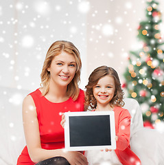 Image showing mother and daughter with tablet pc at home