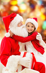 Image showing smiling little girl with santa claus