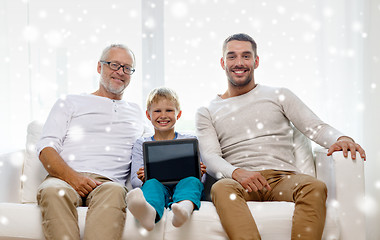 Image showing smiling family with tablet pc at home