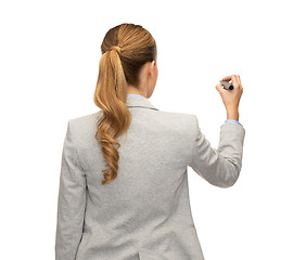 Image showing businesswoman or teacher with marker from back