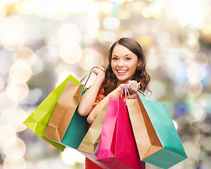 Image showing smiling woman with colorful shopping bags