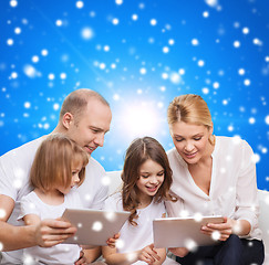 Image showing happy family with tablet pc computers