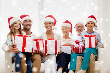 Image showing happy family sitting on couch at home