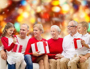 Image showing smiling family with gifts