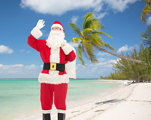 Image showing man in costume of santa claus with bag