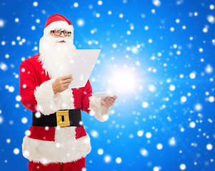 Image showing man in costume of santa claus with letter