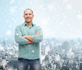 Image showing smiling man with crossed arms