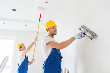 Image showing group of builders with tools indoors