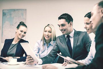 Image showing business team with tablet pc having discussion