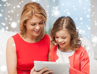 Image showing mother and daughter with tablet pc at home