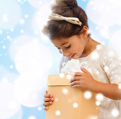 Image showing smiling little girl with gift box