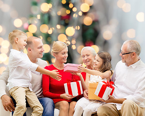 Image showing smiling family with gifts